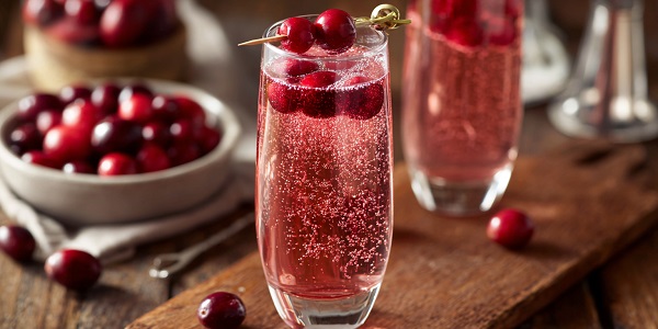 Non-Alcoholic Drinks and Cocktails to Sparkle This New Year’s Eve 13 Cranberry Sparkler with Edible Glitter