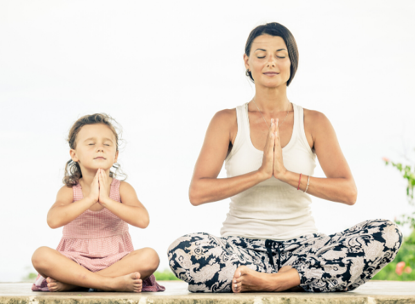 What Type of Mom Will You Be? Take the Quiz 11 mom and daughter doing yoga meditation together - BabyYumYum